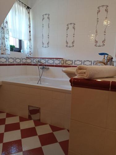 a bathroom with a tub and a sink at Chalupa Beliankovo Ždiar in Ždiar