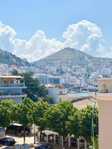 a view of a city with a mountain at RAI Rooms Saranda in Sarandë