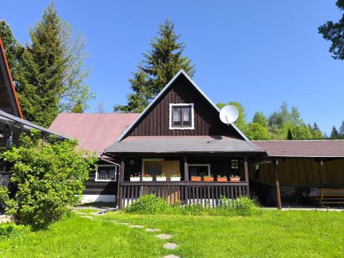 a house with a vegetable stand in the front of it at Privát Evi 166 in Nižná Boca