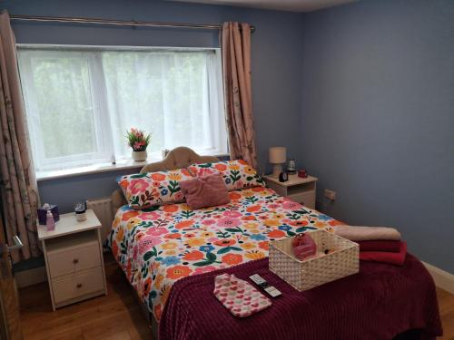 a small bedroom with a bed and a window at Swan Studio Haven in Lisdoonvarna