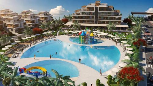 an aerial view of a large swimming pool at a resort at Long Beach Royal Sun Elite Studio with Pool KKTC in Paralimni