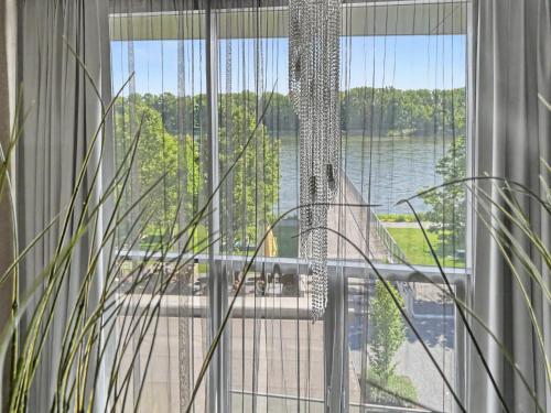 a large window with a view of the water at Eurovea Apartments in Bratislava