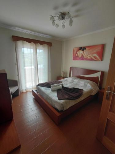a bedroom with a bed and a ceiling at Casa MiraMar in Rabo de Peixe