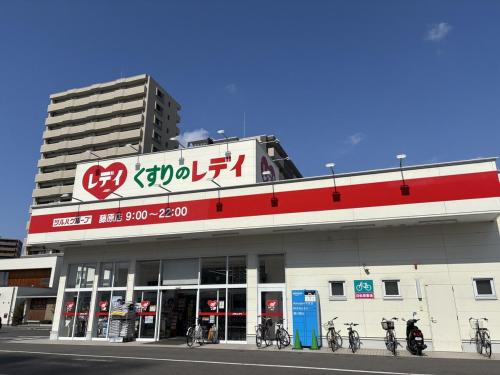 a building with bikes parked in front of it at Orange Stay Matsuyama in Matsuyama