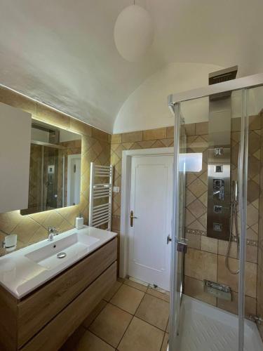 a bathroom with a sink and a shower at Domus Solis Salento in Campi Salentina