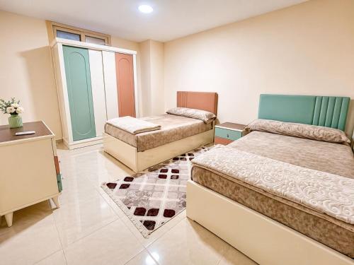a bedroom with two beds at Tiba Golden beach resort hurghada down town in Hurghada