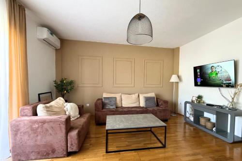a living room with a couch and a table at Boho Apartments in Trebinje