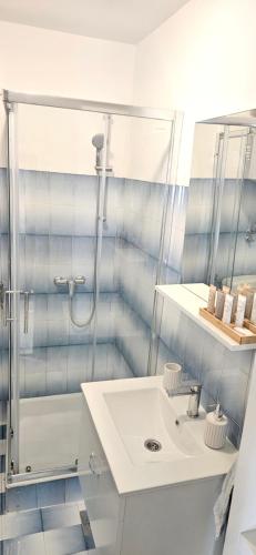a bathroom with a sink and a shower at Accommodation Huljić in Hvar