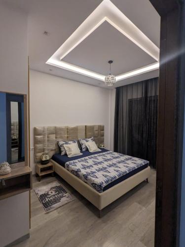 a bedroom with a large bed in a room at MahdiaRafeha in Mahdia