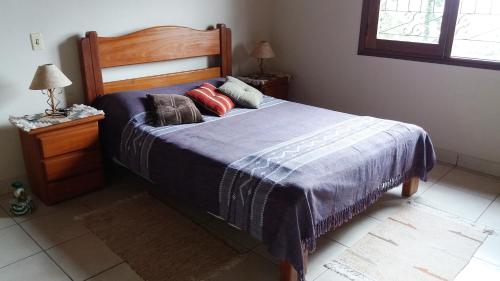 Een bed of bedden in een kamer bij Refúgio do Azzi