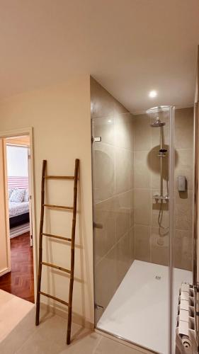 a bathroom with a shower with a ladder in it at Salty Swell in Porto