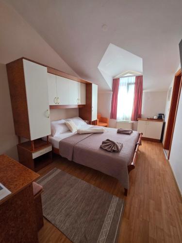 a bedroom with a large bed in a room at Villa Palčić in Novalja