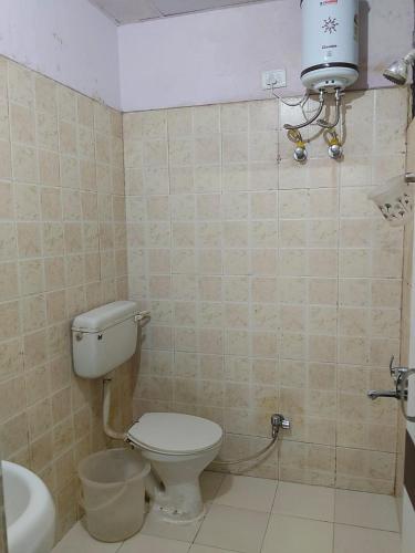 a bathroom with a toilet and a sink at hotel tamanna in Lucknow