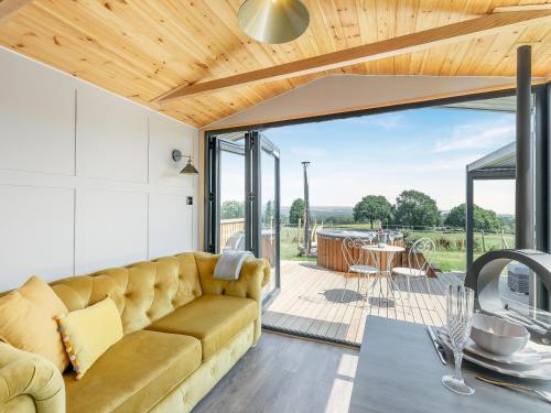 a living room with a couch and a table at Sky Lark Lodge - Uk49904 in Appley Bridge