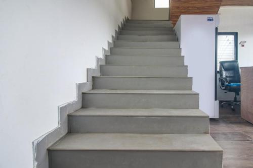 a stairway in an office with a stair case at Hotel O Goyal Inn in Nagpur