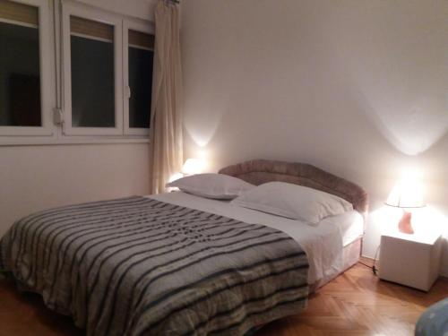 מיטה או מיטות בחדר ב-Apartment Sime