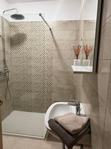 a bathroom with a shower and a toilet and a sink at Pr' Tekcu in Dekani