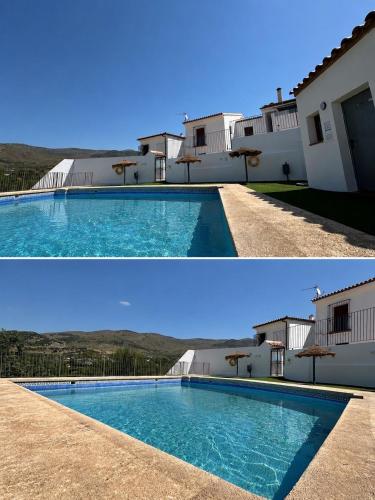 a large swimming pool in front of a building at El Refugio in Fondón