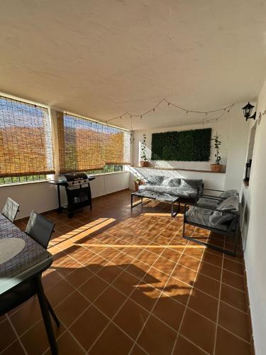 a living room with a couch and a table at El Refugio in Fondón