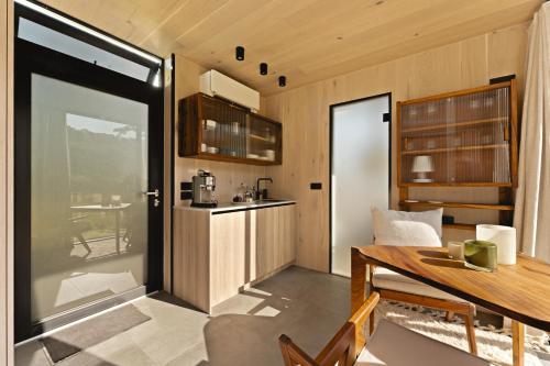 a kitchen and dining room with a table at Sûr Jumigny in Jumigny
