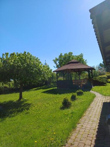 a park with a gazebo in the grass at Pod żurawiem II in Szwalk