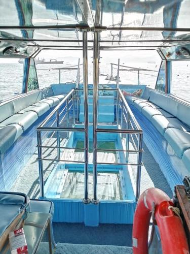 a deck of a boat with stairs on it at AlCaptian Glassboat in Aqaba