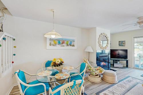 a dining room with a glass table and chairs at Mallard Lakes - 38082 Mockingbird Ln in Selbyville