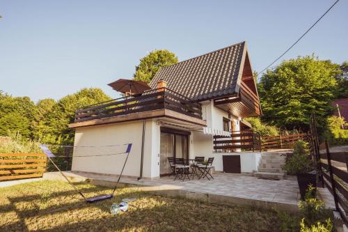 a small house with a pitched roof at Riverside Home Laura in Karlovac