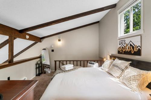 a bedroom with a large bed and a window at Ski-OnSki-Off Camelback Arcade Pool in Tannersville
