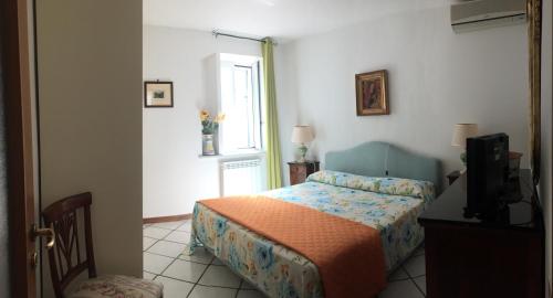 En eller flere senge i et værelse på Casa De Angelis