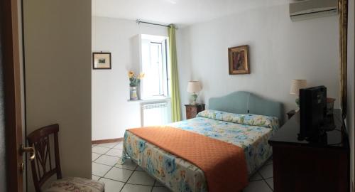 Кровать или кровати в номере Casa De Angelis