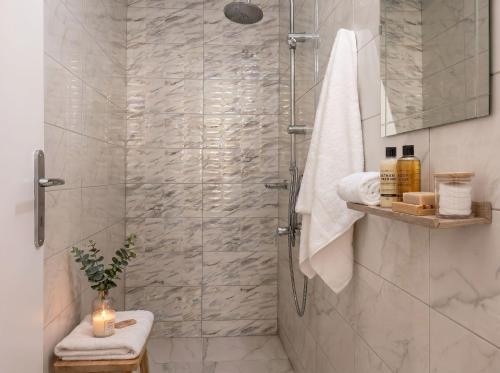 a bathroom with a shower with a glass door at Lilu Villa 1 with Private Pool and Seaview in Tigaki
