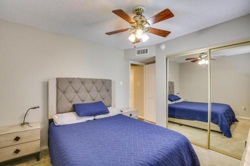 a bedroom with a bed and a ceiling fan at Remote Work Ready! Central Yuma Condo w/ Patio in Yuma