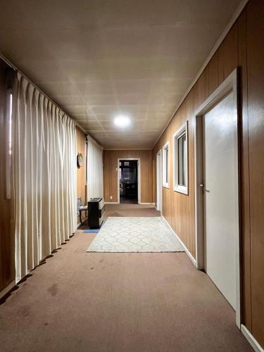 an empty hallway with a hallway at La Casona - Refugio Austral in Punta Arenas