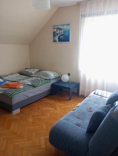 a living room with two beds and a couch at villa in Nowa Ruda