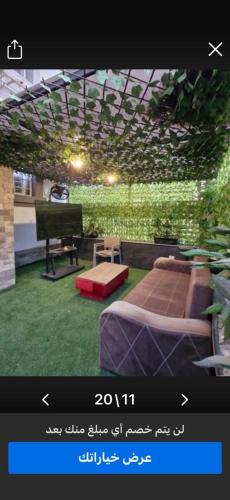 a picture of a room with a bed and a piano at Gardinia City Apartment in Cairo