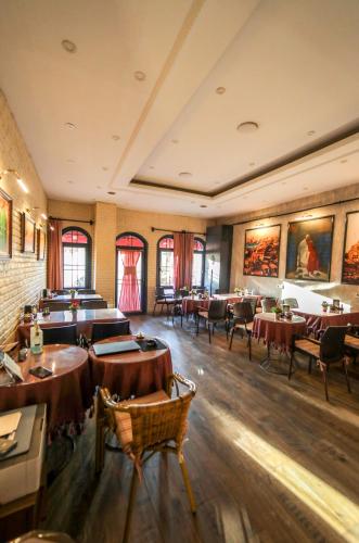 a restaurant with tables and chairs in a room at Astro Suites in Istanbul