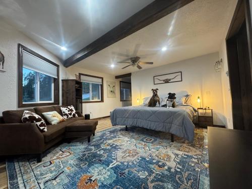a living room with a bed and a couch at Lakeview 4BR Huge Deck Dog Friendly ADA in Lakeside
