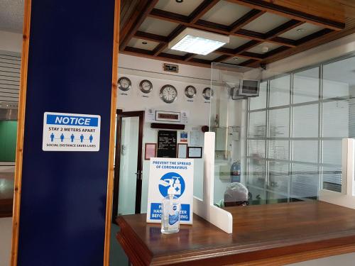 a store window with a notice sign on it at Rittoo Complex -Gavnor in Quatre Bornes