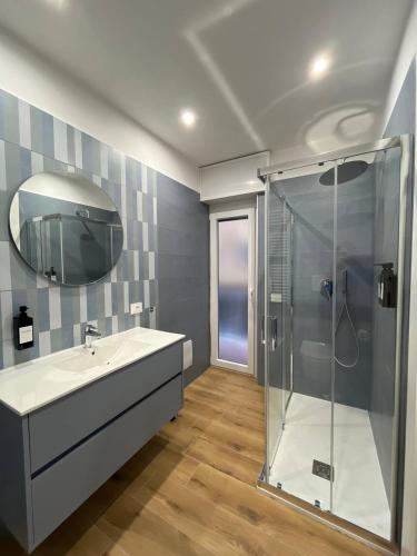 a bathroom with a sink and a shower at The Family Rooms, Rione alto, Zona ospedaliera in Naples