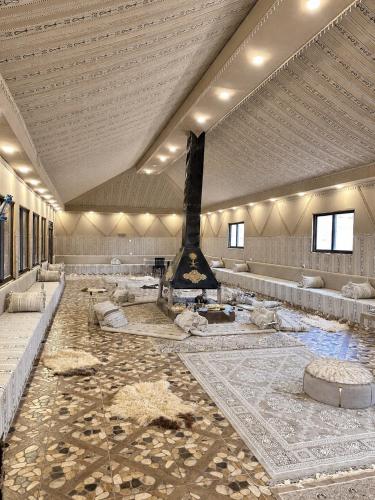 a large room with a fountain in the middle at MAJDOLINE Desert Camp in Wadi Rum