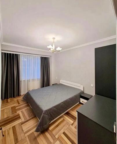 a bedroom with a large bed in a room at Tumo cozy corner in Yerevan