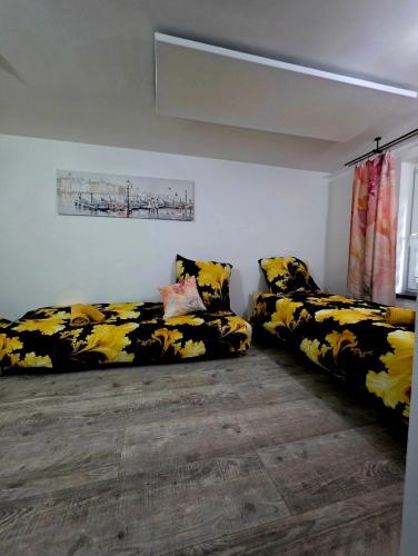 a living room with two couches in a room at Apartament Rosa in Rydułtowy