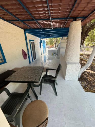 a picnic table and chairs on a patio at DaSH EV in Bodrum City