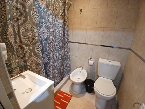 a small bathroom with a toilet and a sink at SL 1908 in Olivos