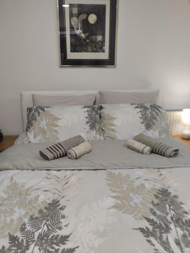 a bed with two pillows on top of it at Studio Djordjevic in Kraljevo