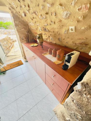 a kitchen with a counter with a toaster on it at Mani Spot by the Sea in Gerolimenas