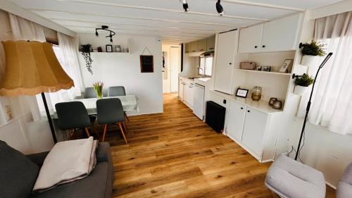 a living room with a table and a kitchen at Hofquartier Greven in Greven