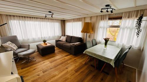 a living room with a couch and a table at Hofquartier Greven in Greven