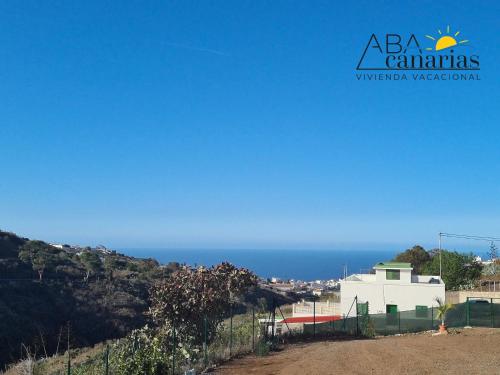 a view of the ocean from the side of a hill at Abadog Canarias in Firgas